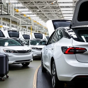 Electric vehicles being assembled at a modern factory.